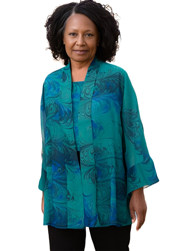 Woman wearing silk kimono and top in greens
