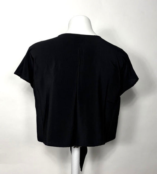 Black silk jacket on a mannequin against a white background