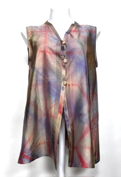 Hand dyed dupioni silk vest on a mannequin against a white background