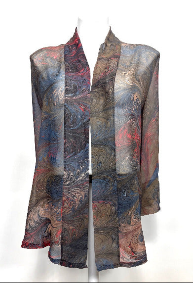 Colorful marbled silk kimono on a mannequin against a white background