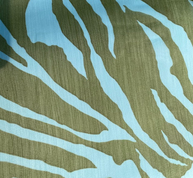 Close up of blue and green tiger pattern on scarf