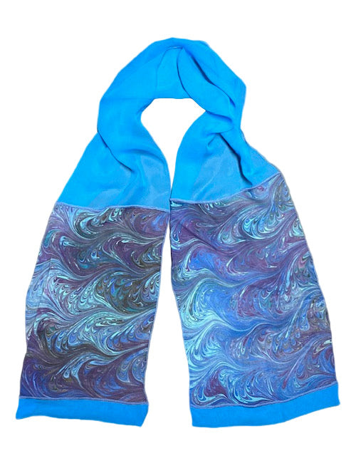 Blue and purple marbled scarf on a gray background