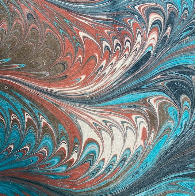 Marbled pattern with swirling colors of blue, sienna, and ivory.