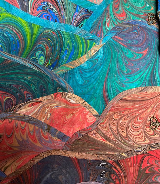 Closeup of the stitching detail of marbled silk art vest