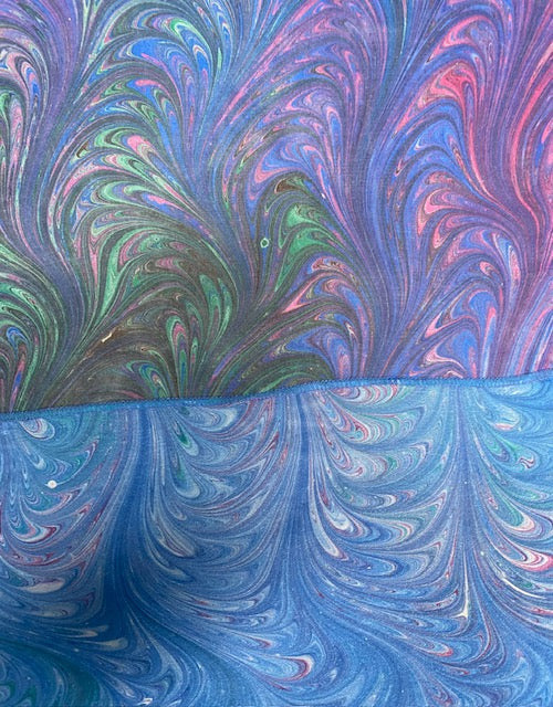 Closeup of marbled sections of silk scarf with beautiful connecting stitching
