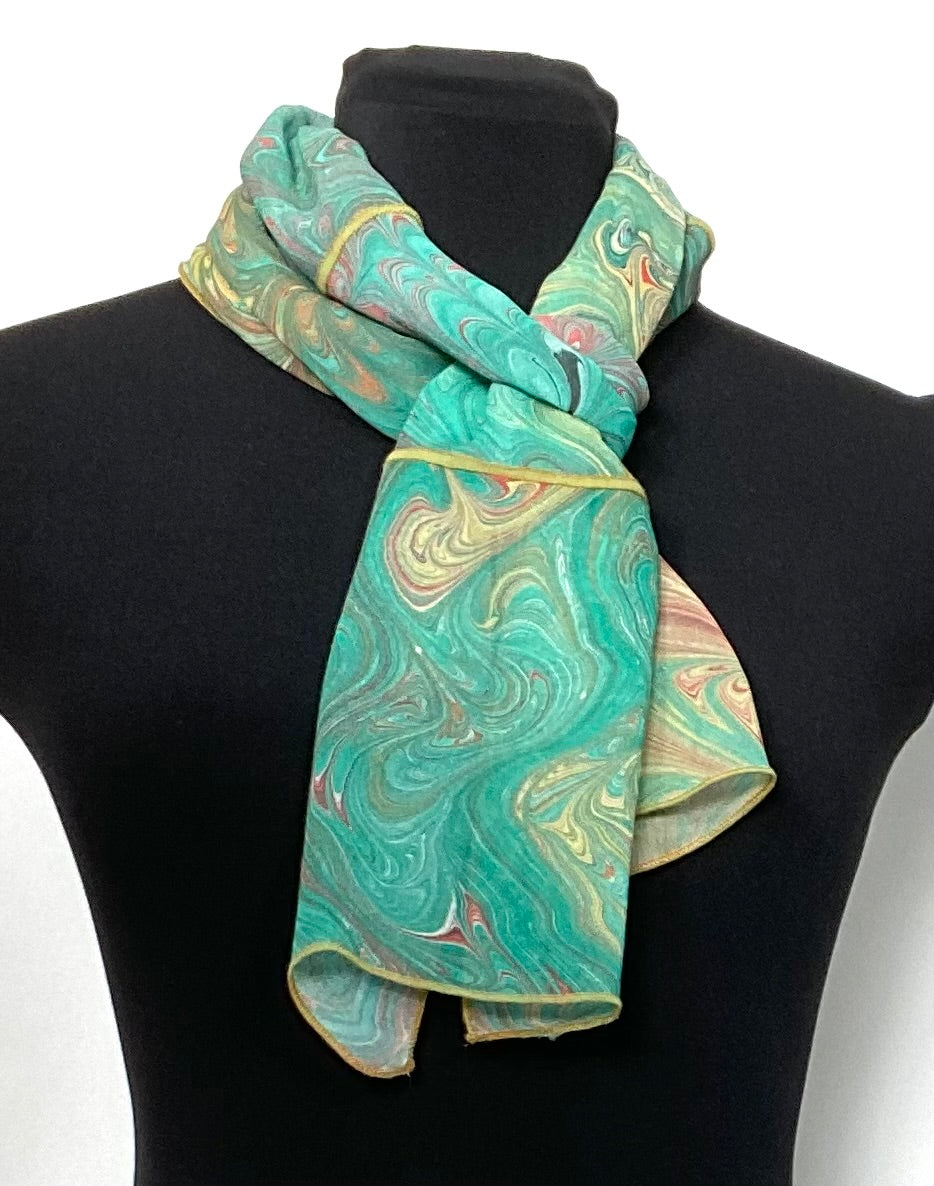 Moss green with gold marbled silk scarf on a black mannequin