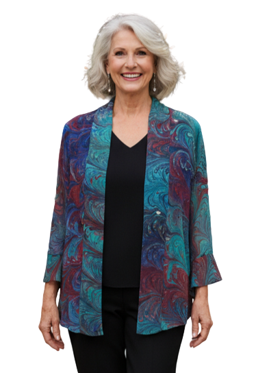 Woman wearing a colorful marbled silk jacket on a white background