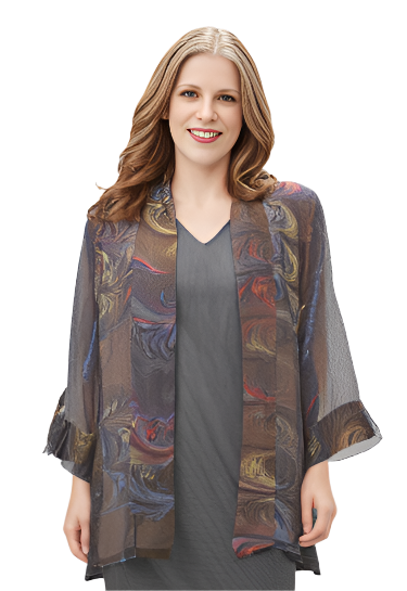 Woman wearing a gray dress with a hand marbled sheer jacket on a white background