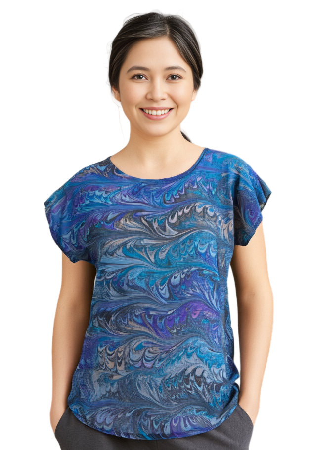 Woman wearing a blue hand marbled silk short sleeve top on a white background
