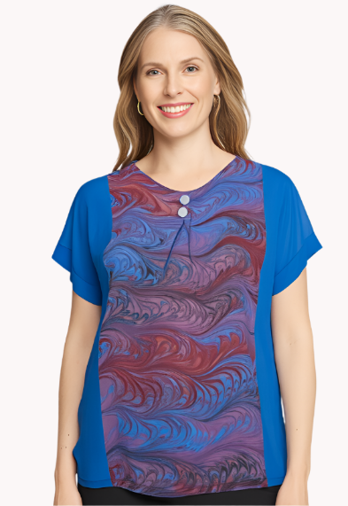 Woman wearing a silk top in dyed skyblue with a pink and blue marbled center inset