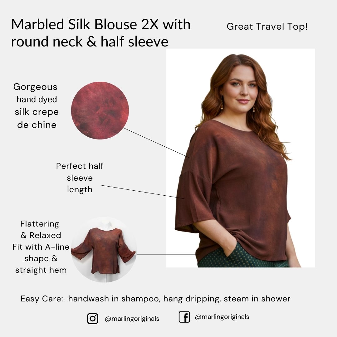 Marbled silk blouse with round neck and half sleeve worn by a model, with product details on a white background.