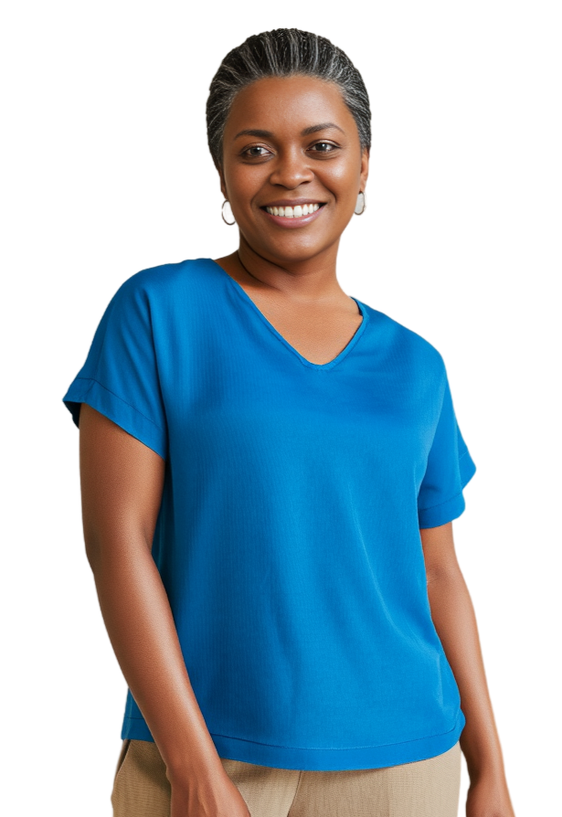 Woman wearing a hand dyed blue silk t-shirt on a white background