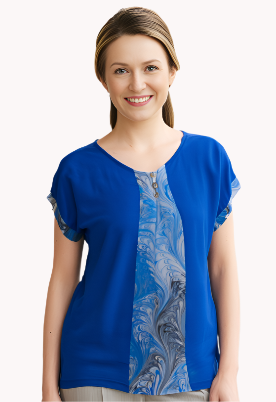 Woman wearing a dyed blue blouse with a marbled inset
