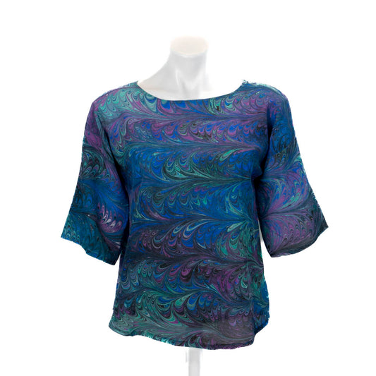 Marble silk, top and black blue, green and violet on a mannequin against a white background