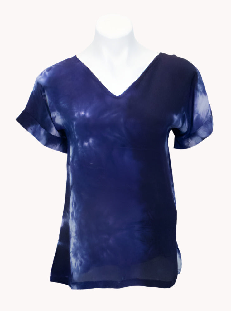 Deep navy and blue tie-dye silk t-shirt on a mannequin against a white background