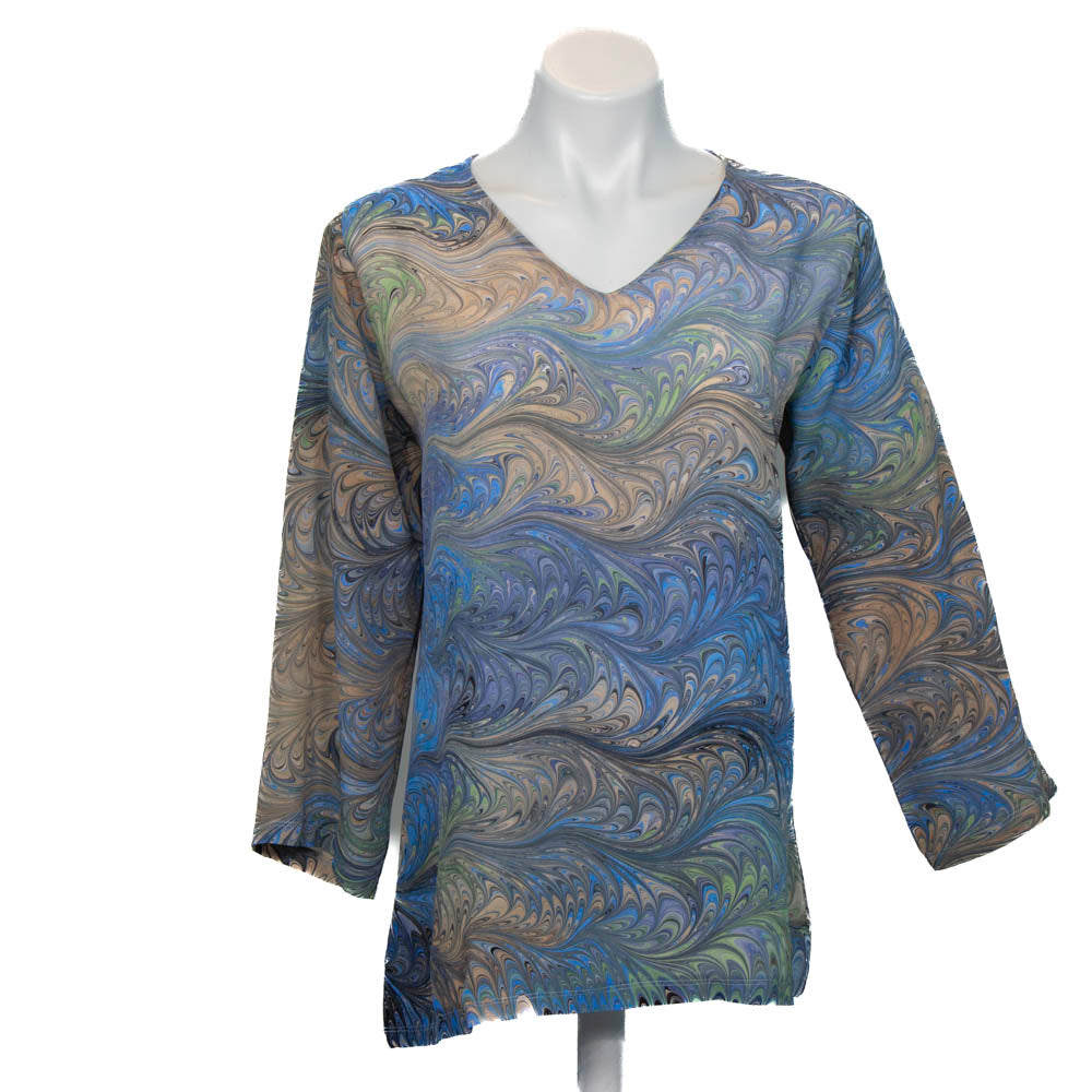 Marbled silk tunic in gray blue peach and tan with v neck and three-quarter sleeves automatic against a white background