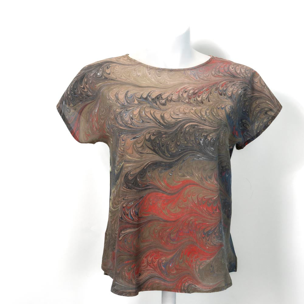 Marble short sleeve silk blouses, and browns with red on a mannequin against a white background