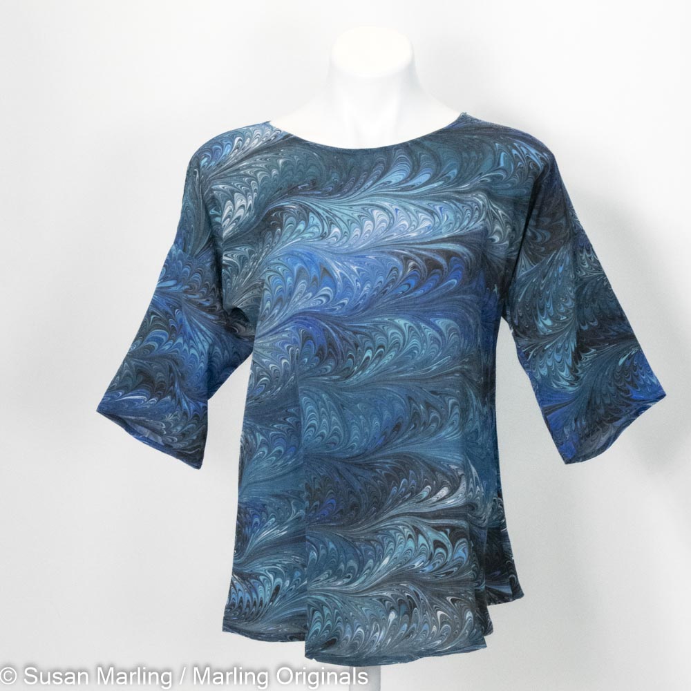 marbled silk blouse in teal, blue, black, white. Half sleeves. Round neck.