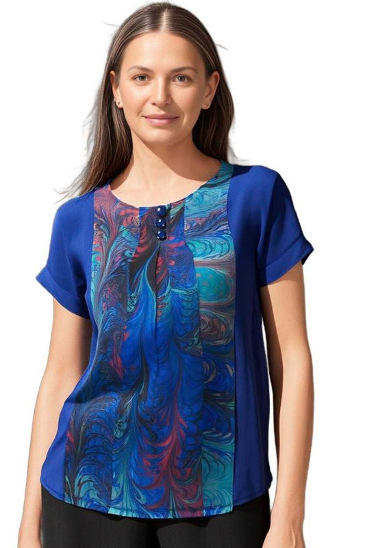 woman wearing a dyed and marbled silk shirt in royal blue tones