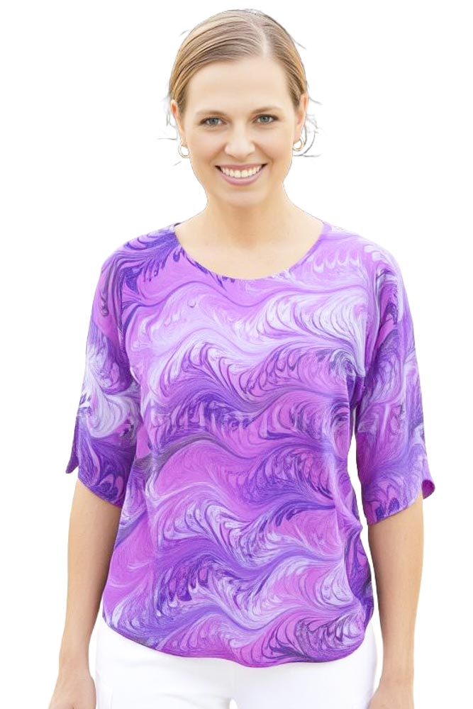 woman wearing pink and lavender silk top marbled with feathered pattern