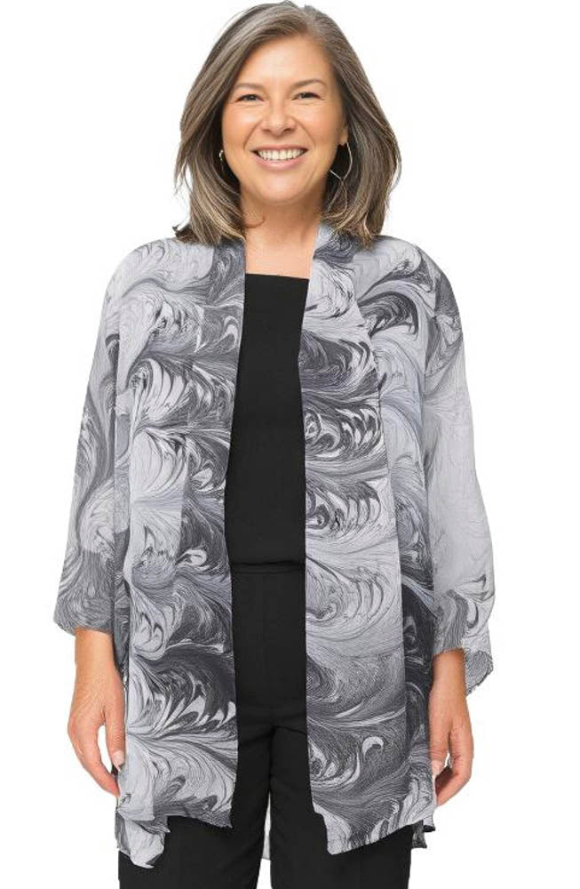 woman wearing a black and white sheer marbled kimono jacket