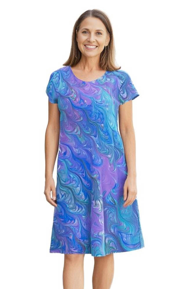 woman wearing silk bias cut marbled dress in soft summer colors