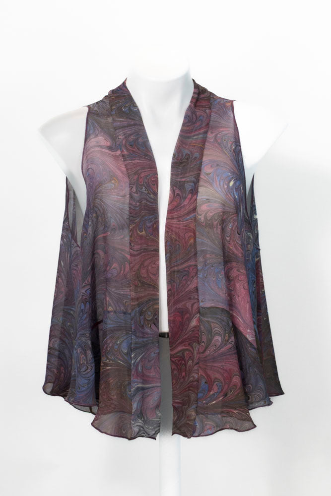 Marbled silk chiffon fast in cranberries and brown on mannequin against white background