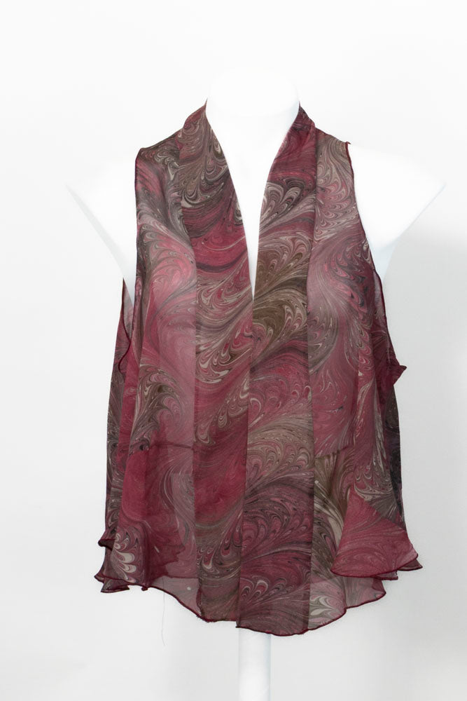 Marbled silk chiffon vest in cranberry and brown colors against white background