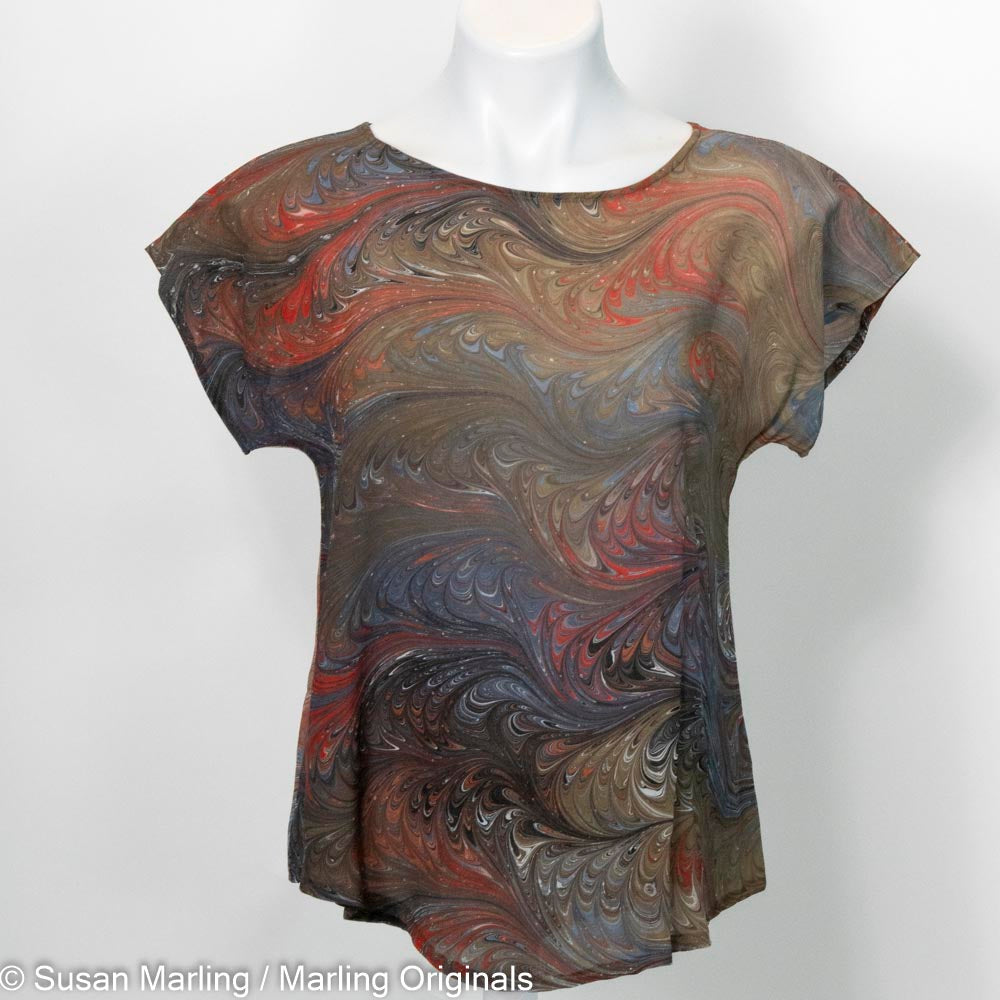 Silk blouse marbled in browns, tan with accents of red. Short sleeves. Round neck