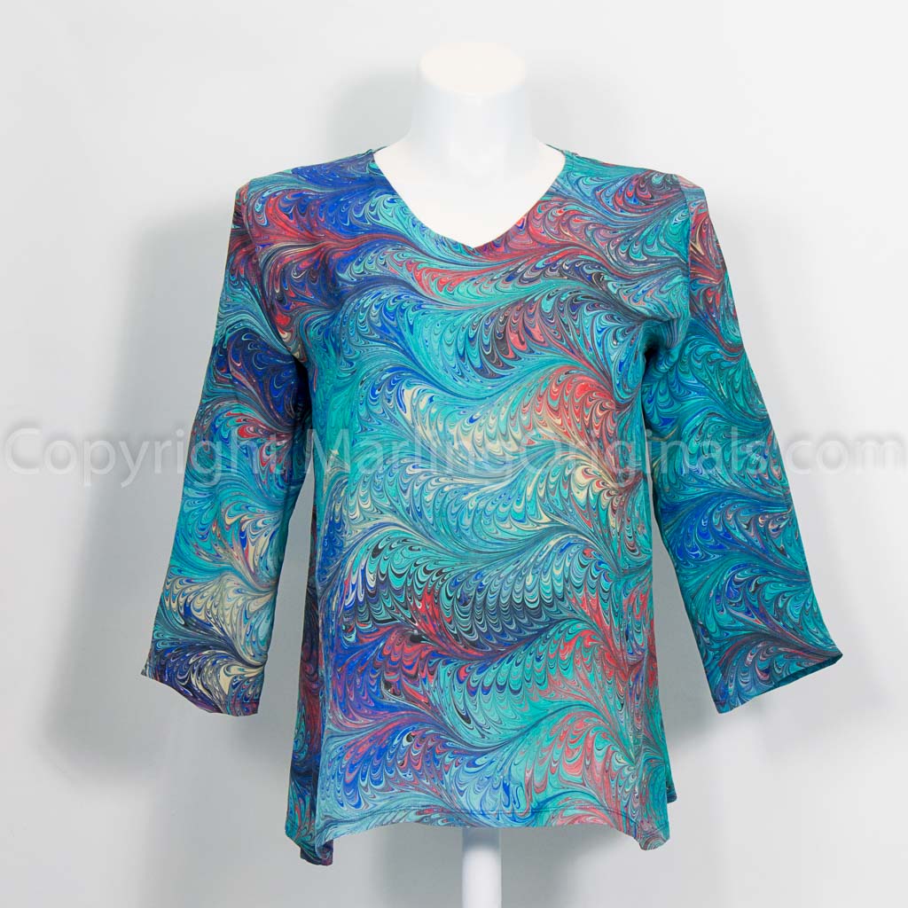 Feather marbled silk tunic in green teal with blue, red, yellow accents. V neck. 3/4 sleeve.