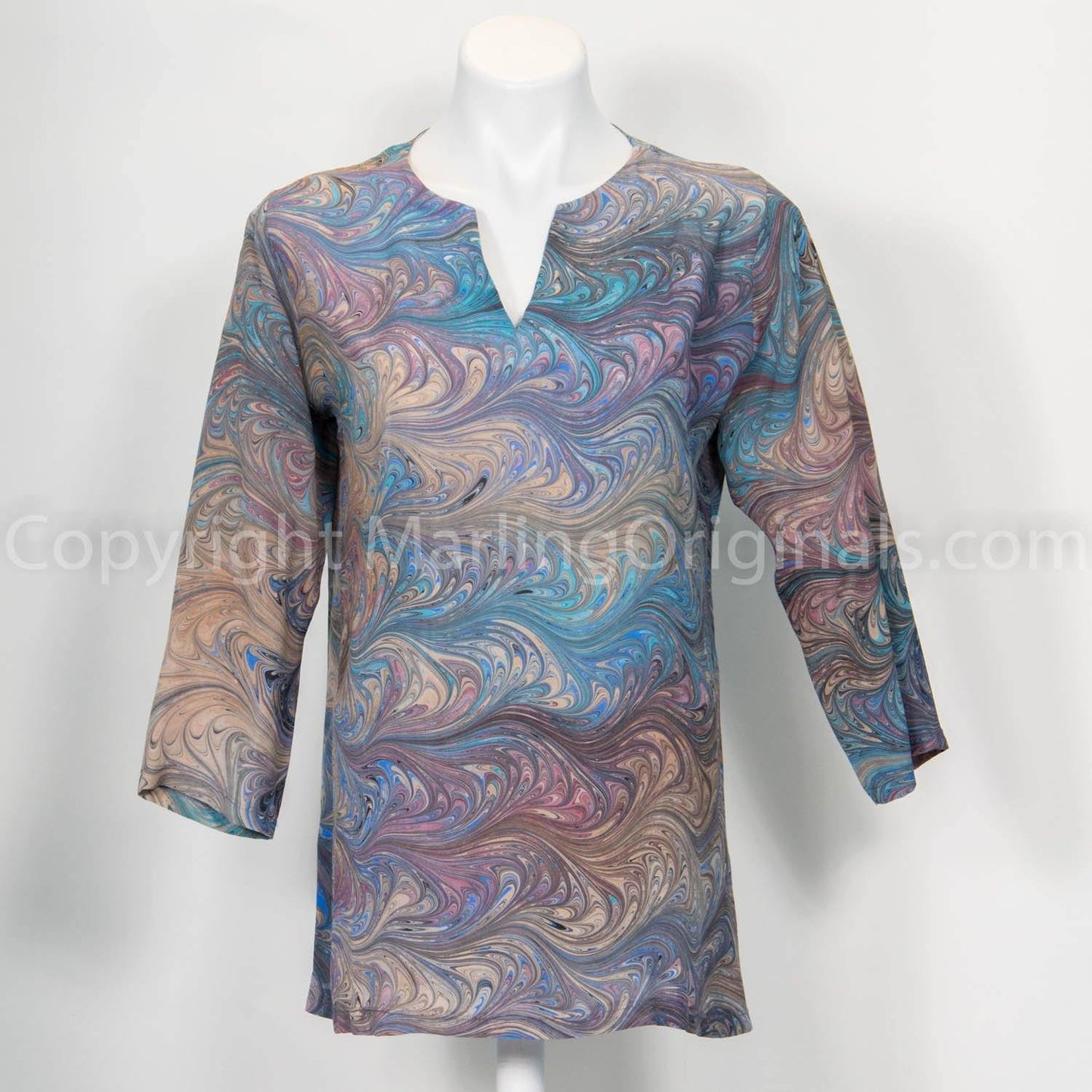 marbled silk tunic top in warm mauve, teal, peach tones. Long sleeves, side slits, v-notch neck
