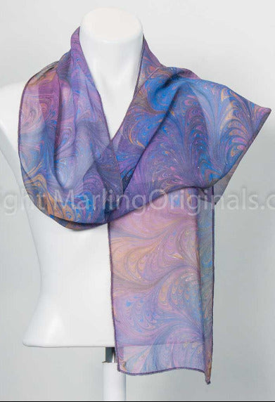Sheer scarf marbled in a feathered pattern in orchid, soft blue, peach and grey colors