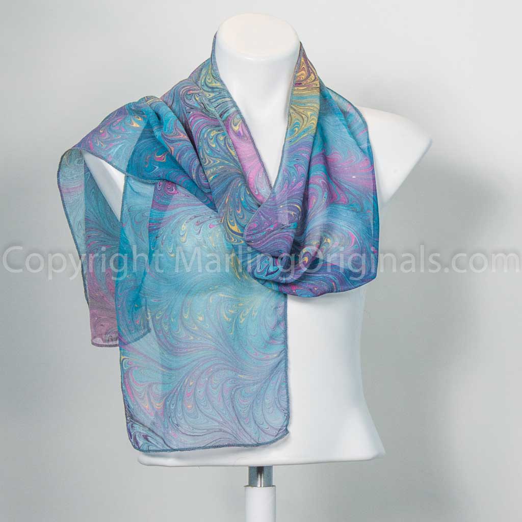 teal green scarf with bright magenta and yellow feathered accents