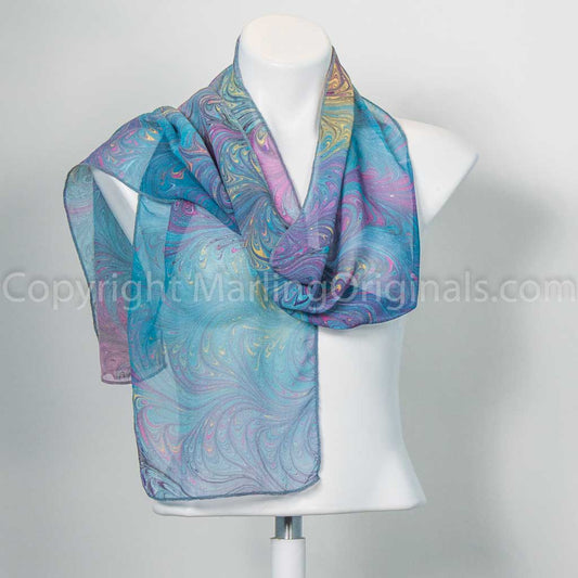 teal green scarf with bright magenta and yellow feathered accents