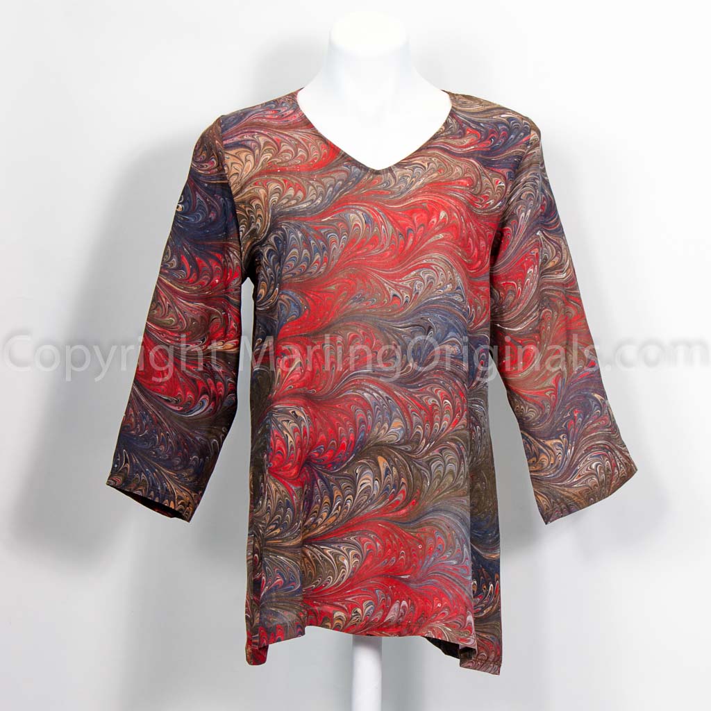 marbled feather pattern in browns with red. Silk tunic with v neck and 3/4 sleeves.