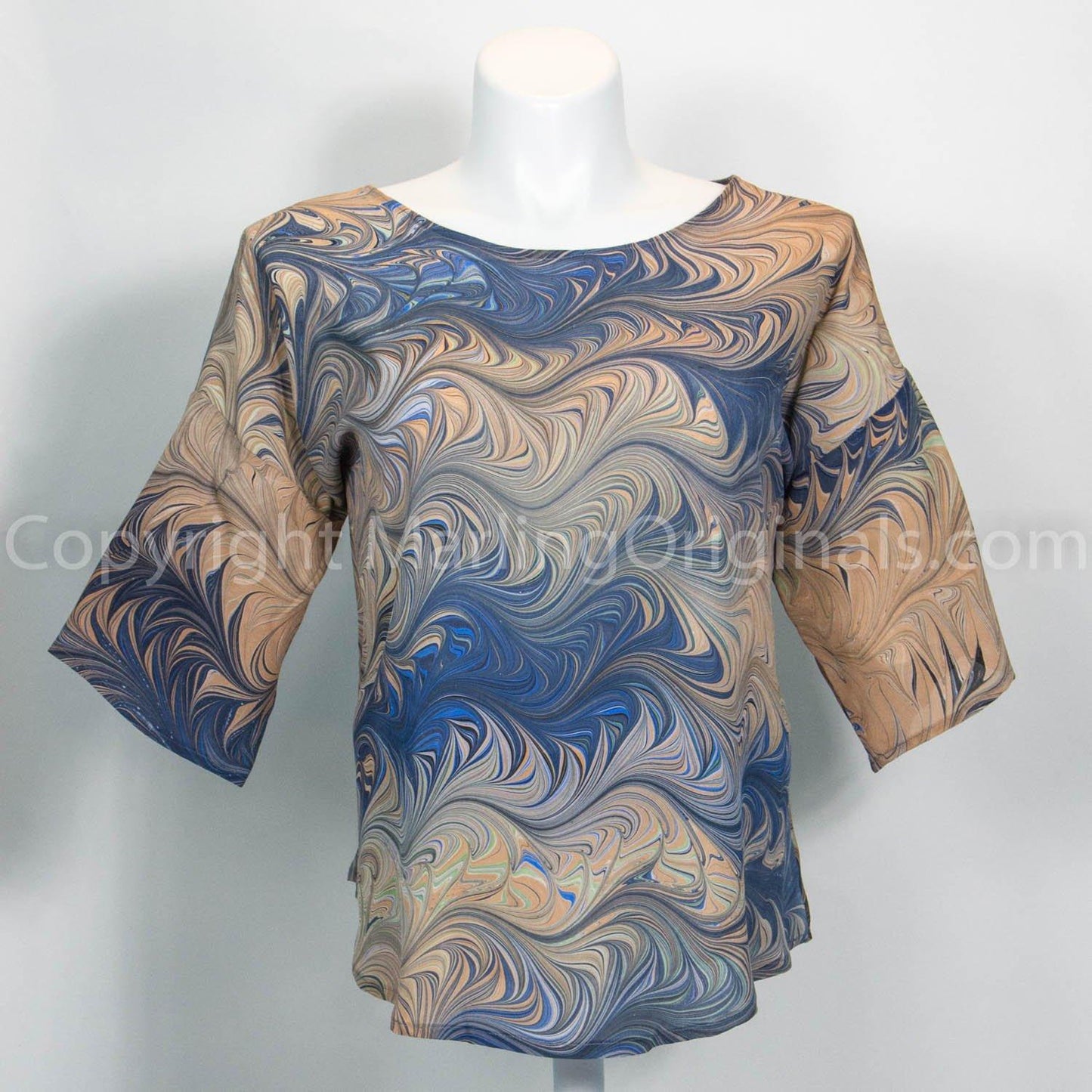hand marbled brown silk top with navy accents. Longer sleeve, round neck, curved hem