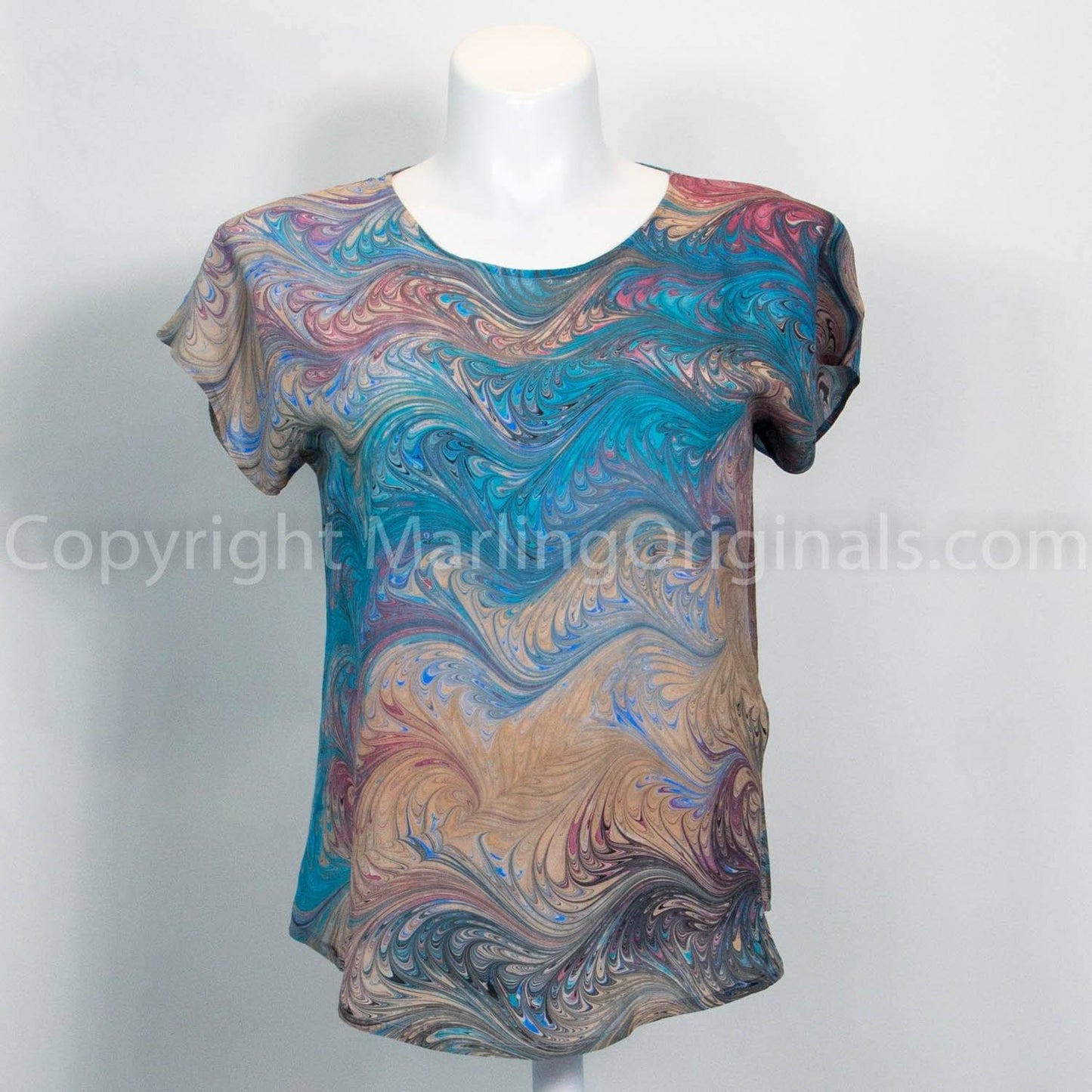 marbled silk blouse in teal, sand, rose colors. Short sleeves, round neck, curved hem