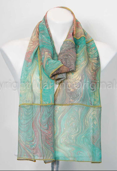 marbled scarf pieced together in soft green shades with gold on mannequin against white background