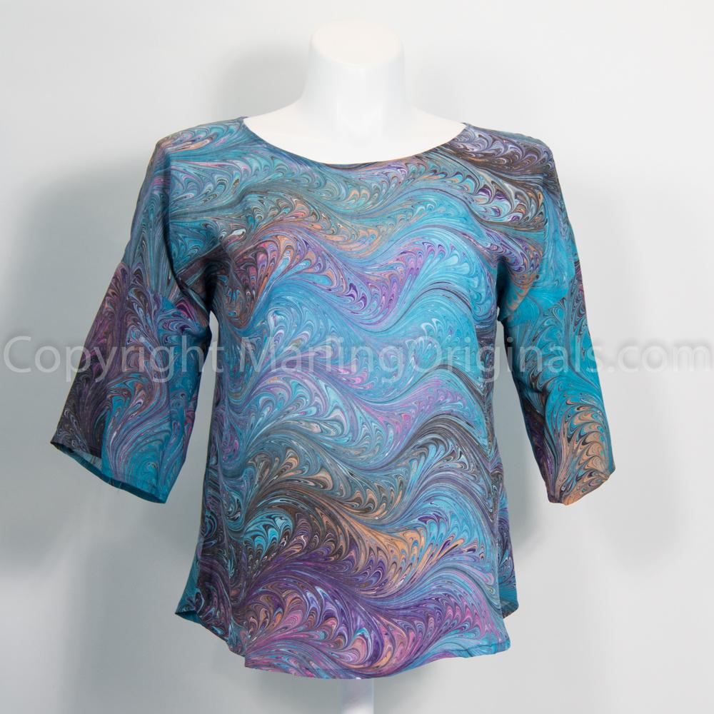 marbled silk teal blouse with touches of pink, gold, purple and black. Half sleeve design.