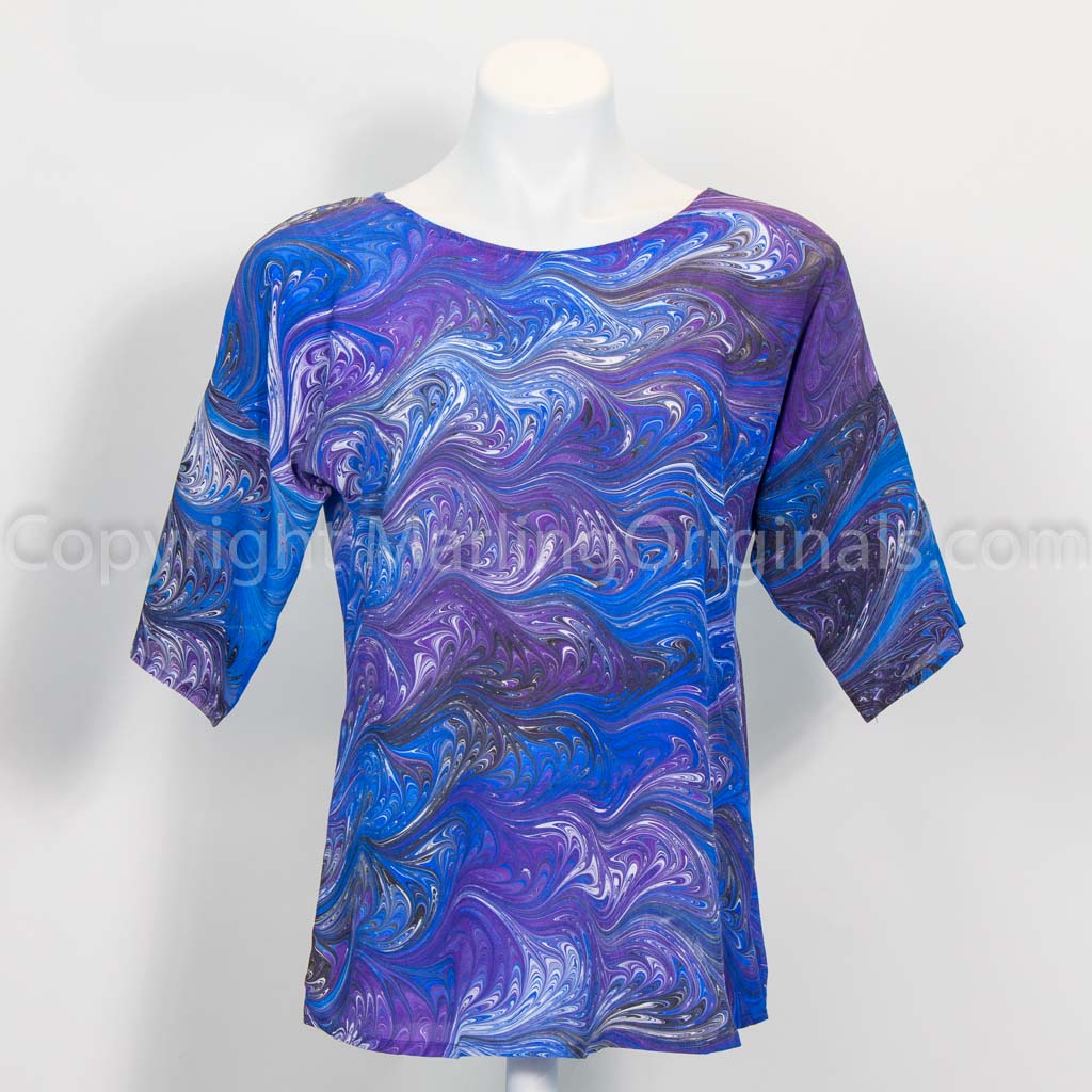 marbled silk top in blue, purple,black, white with round neck, half sleeve, curved hem.