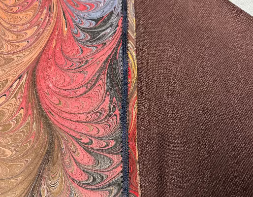 Close-up of marbled silk scarf showing brown lining fabric
