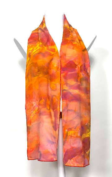 Hand painted colorful silk scarf on a mannequin on a white background