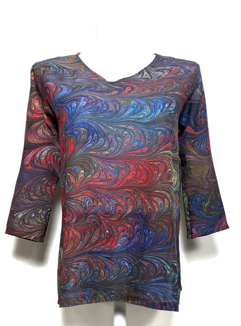 Colorful marbled silk tunic on a white background