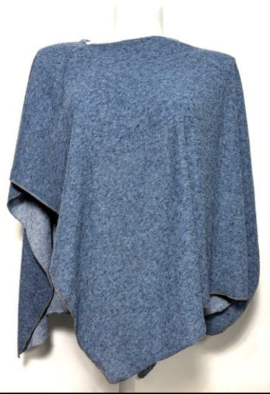 Blue knitted poncho on a white background