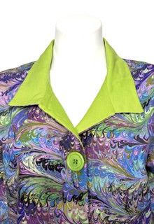 Colorful marbled cotton jacket with a green collar on a mannequin