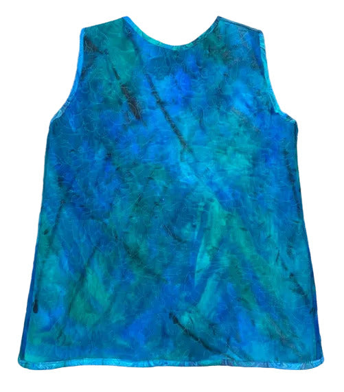 back of blue quilted vest with handpainted abstract pattern