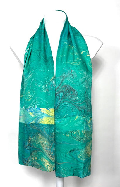 Green and blue marbled scarf on a white mannequin
