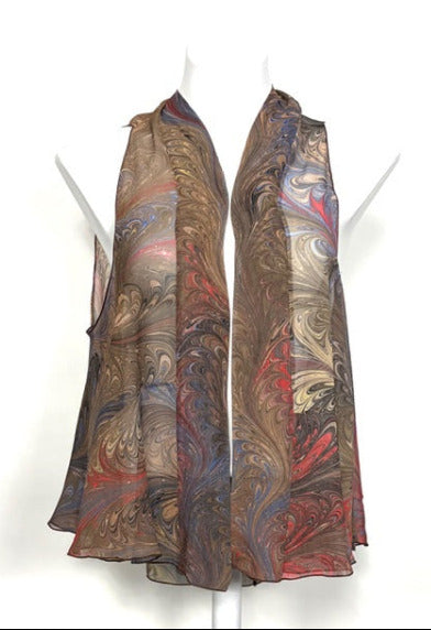 Marbled silk flowy vest on mannequins against a white background