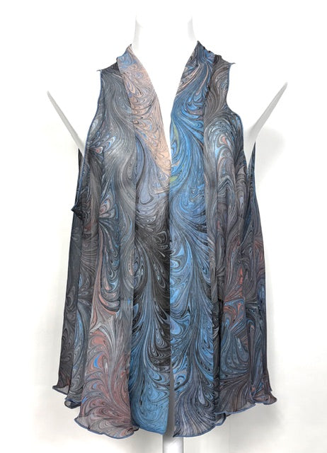 Marbled silk sheer vest on mannequins against a white background
