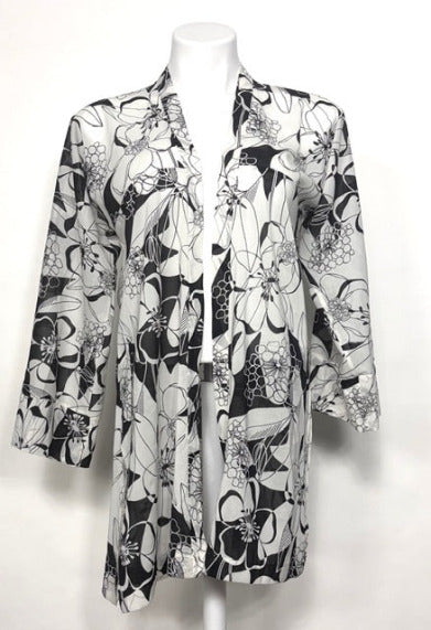 Graphic floral patterned kimono on a mannequin against a white background